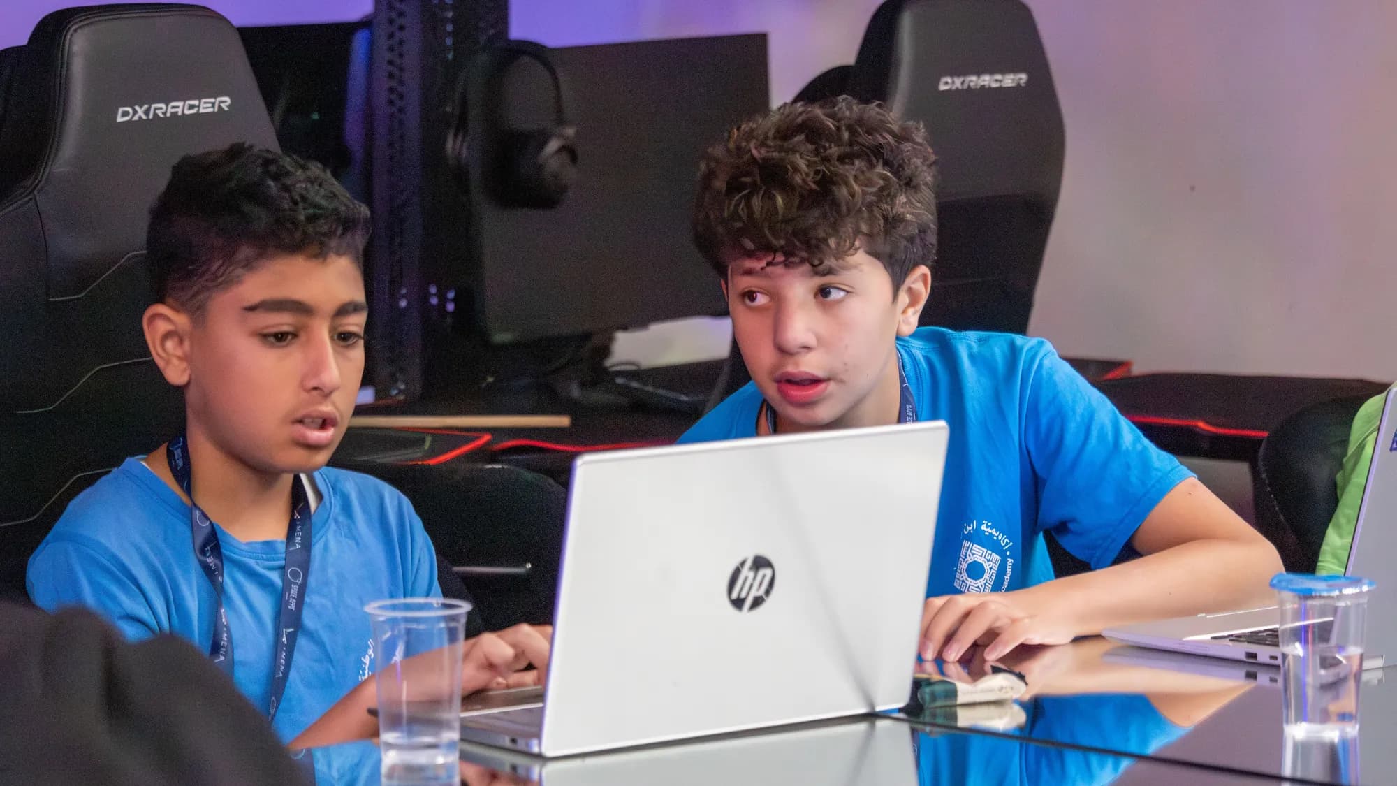 Two young participants working together at a laptop