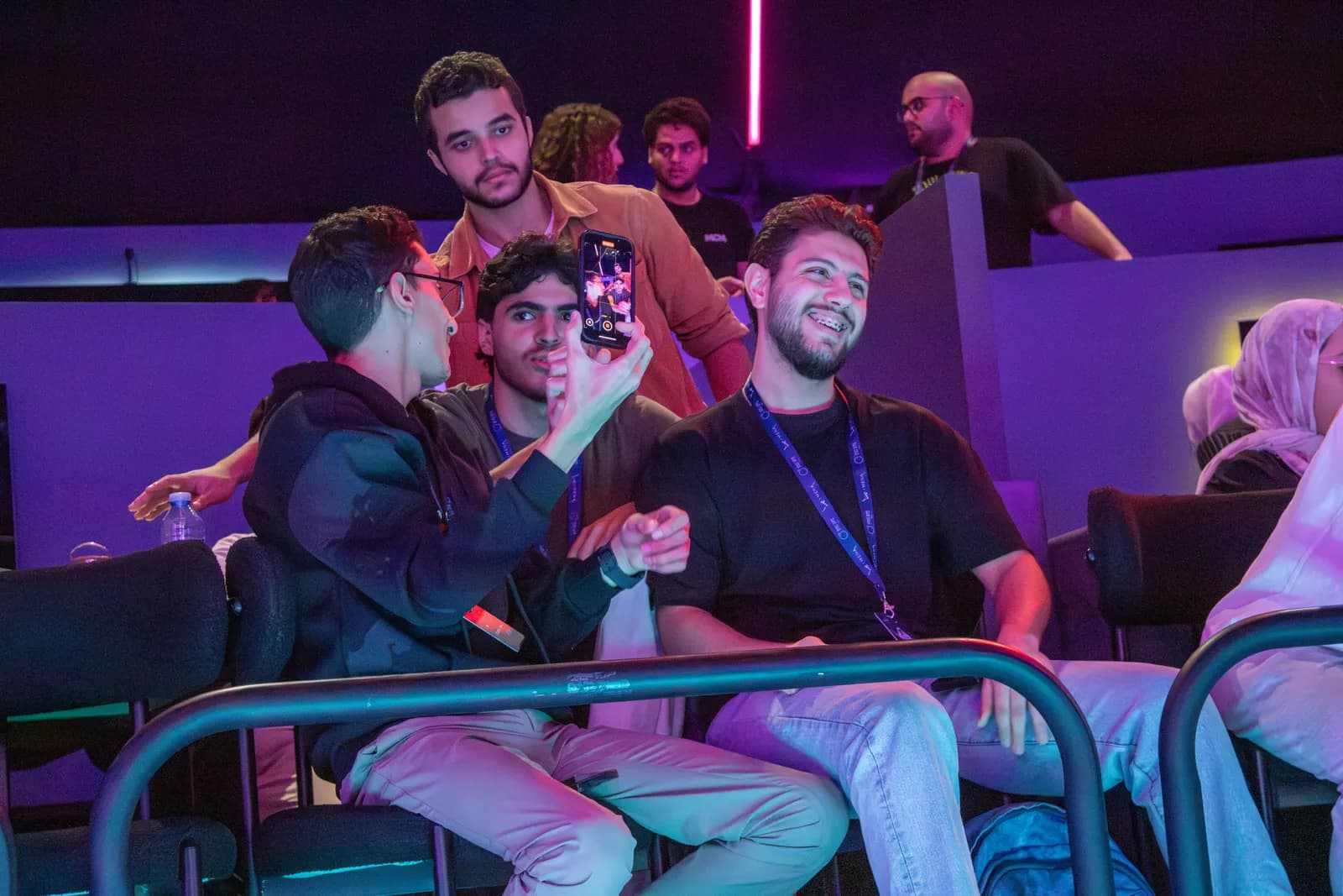 Participants seated together watching a presentation