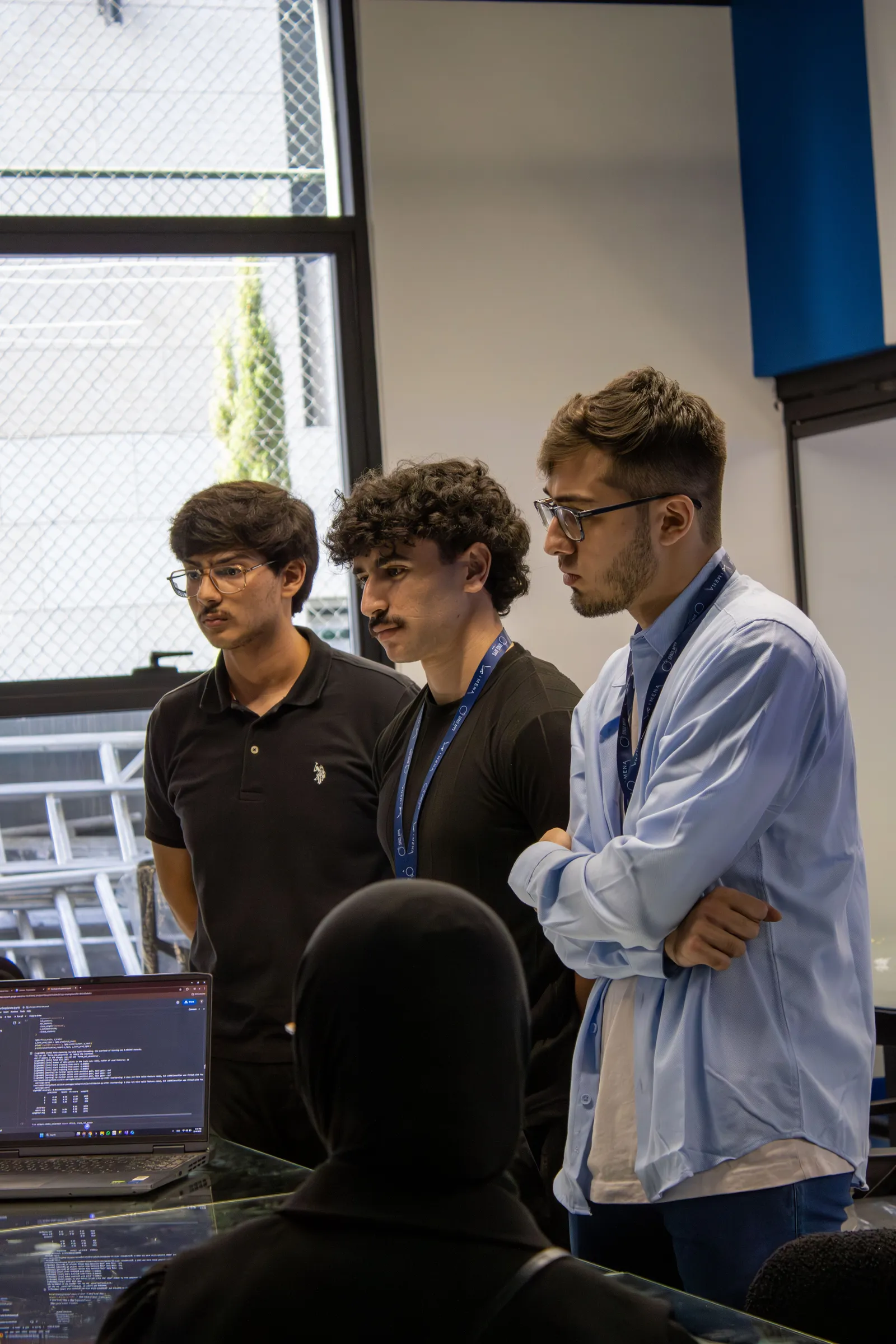 Three participants standing and talking